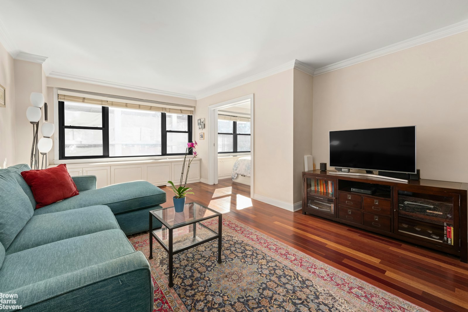 a living room with furniture and a flat screen tv