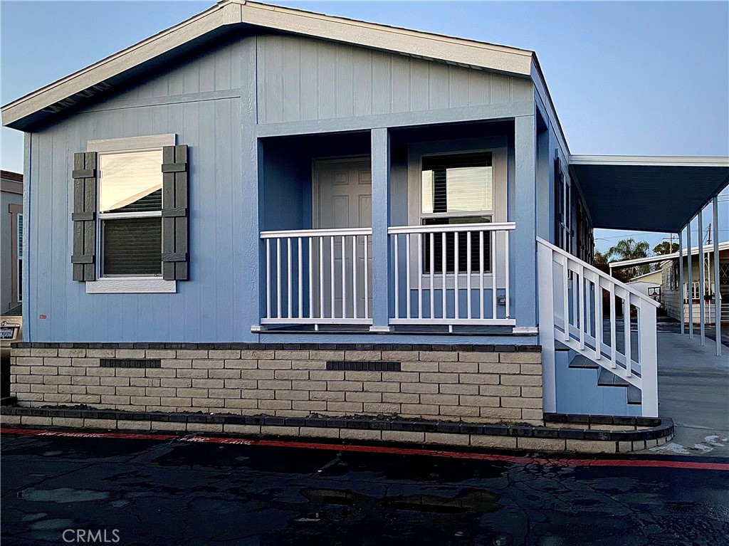 a view of a house with wooden deck