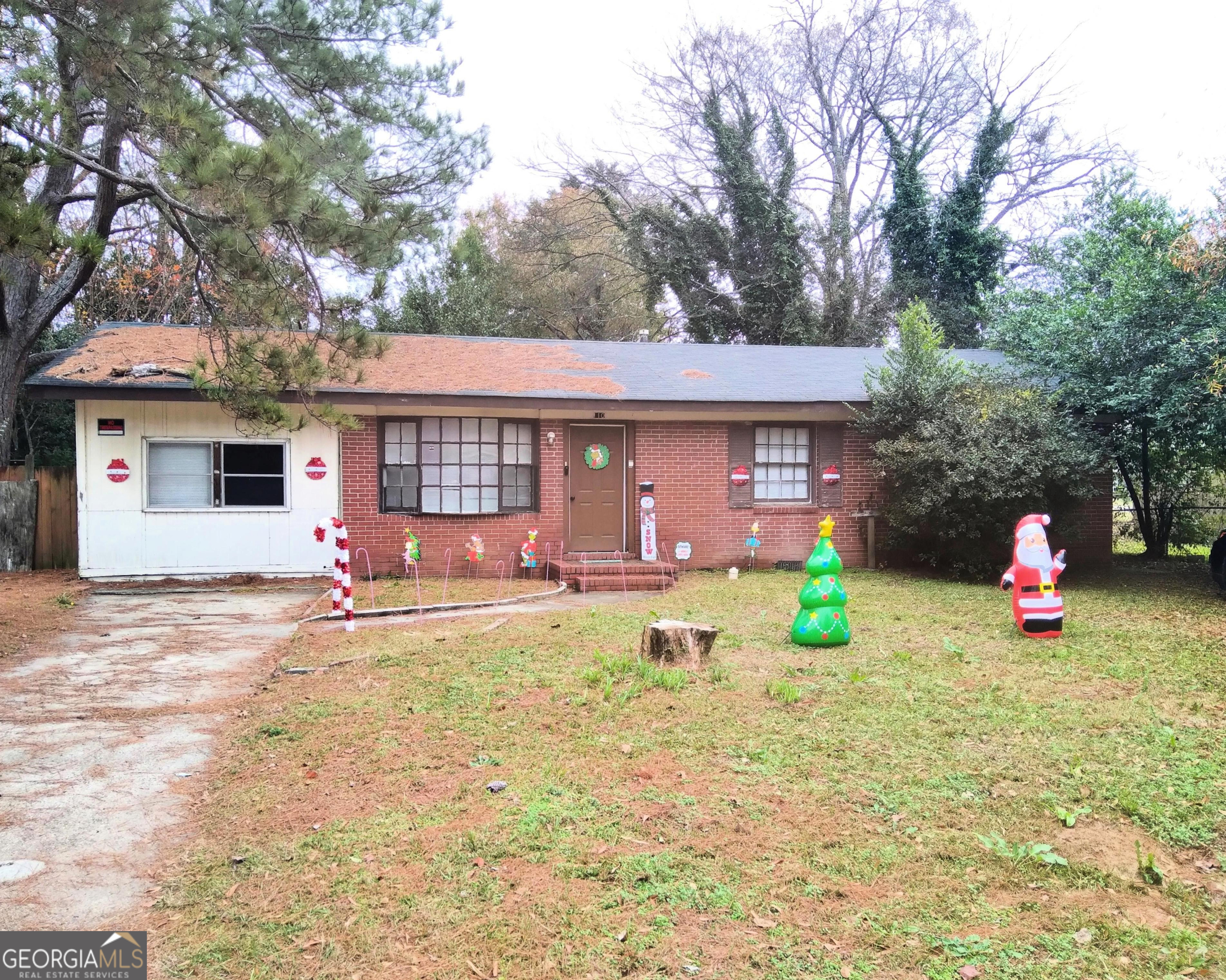 a front view of a house with yard