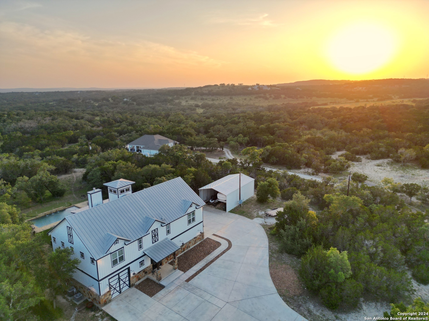 an aerial view of residential house with parking space