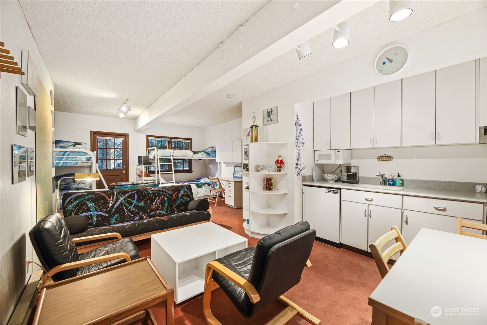 a kitchen with stainless steel appliances kitchen island granite countertop a sink and cabinets