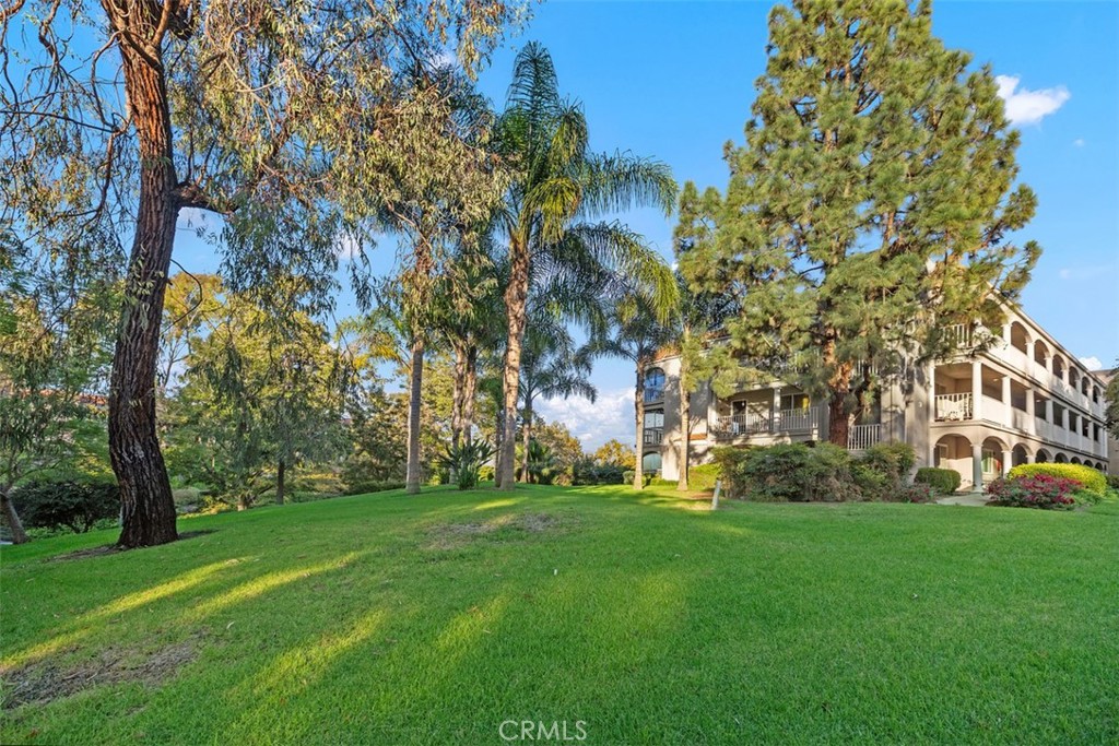 a view of a building with a yard