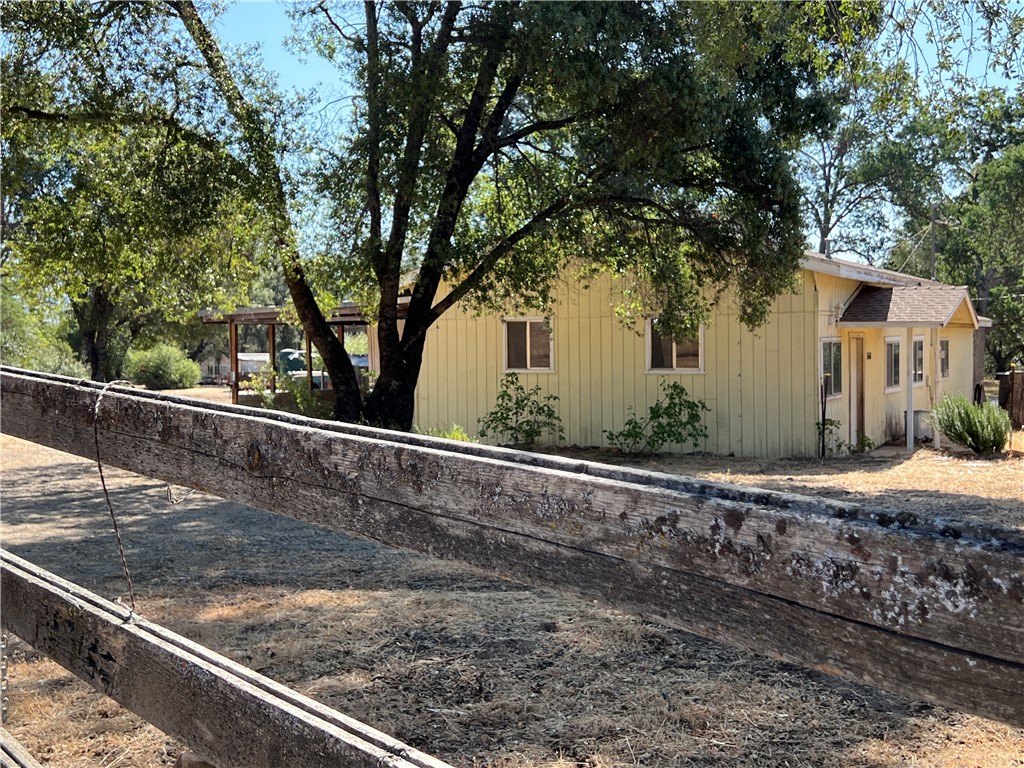 a view of a house with a tree