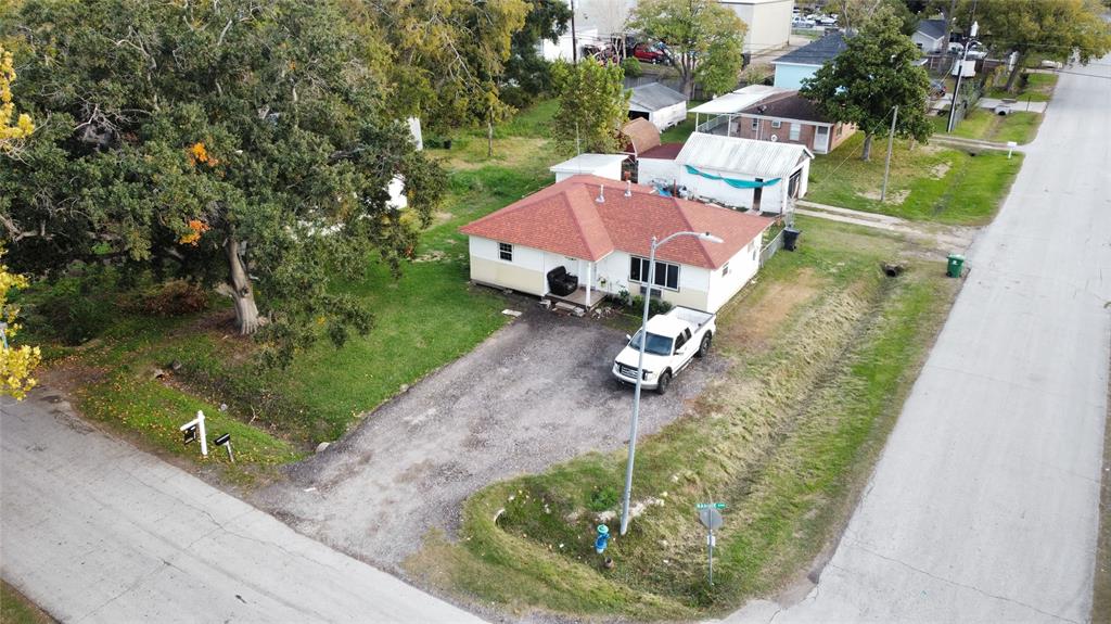 an aerial view of a house with outdoor space