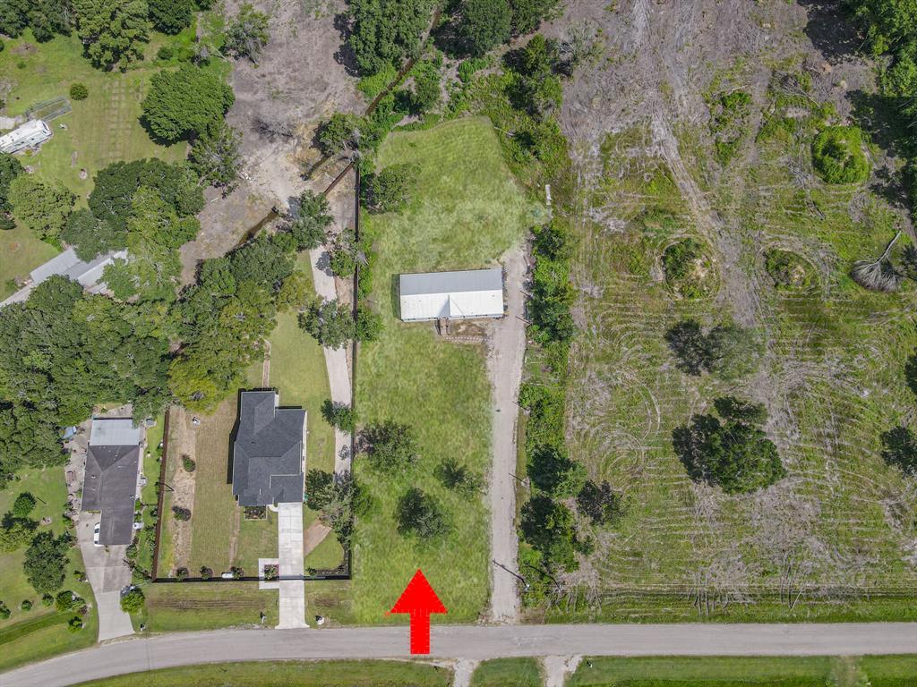 an aerial view of houses with yard