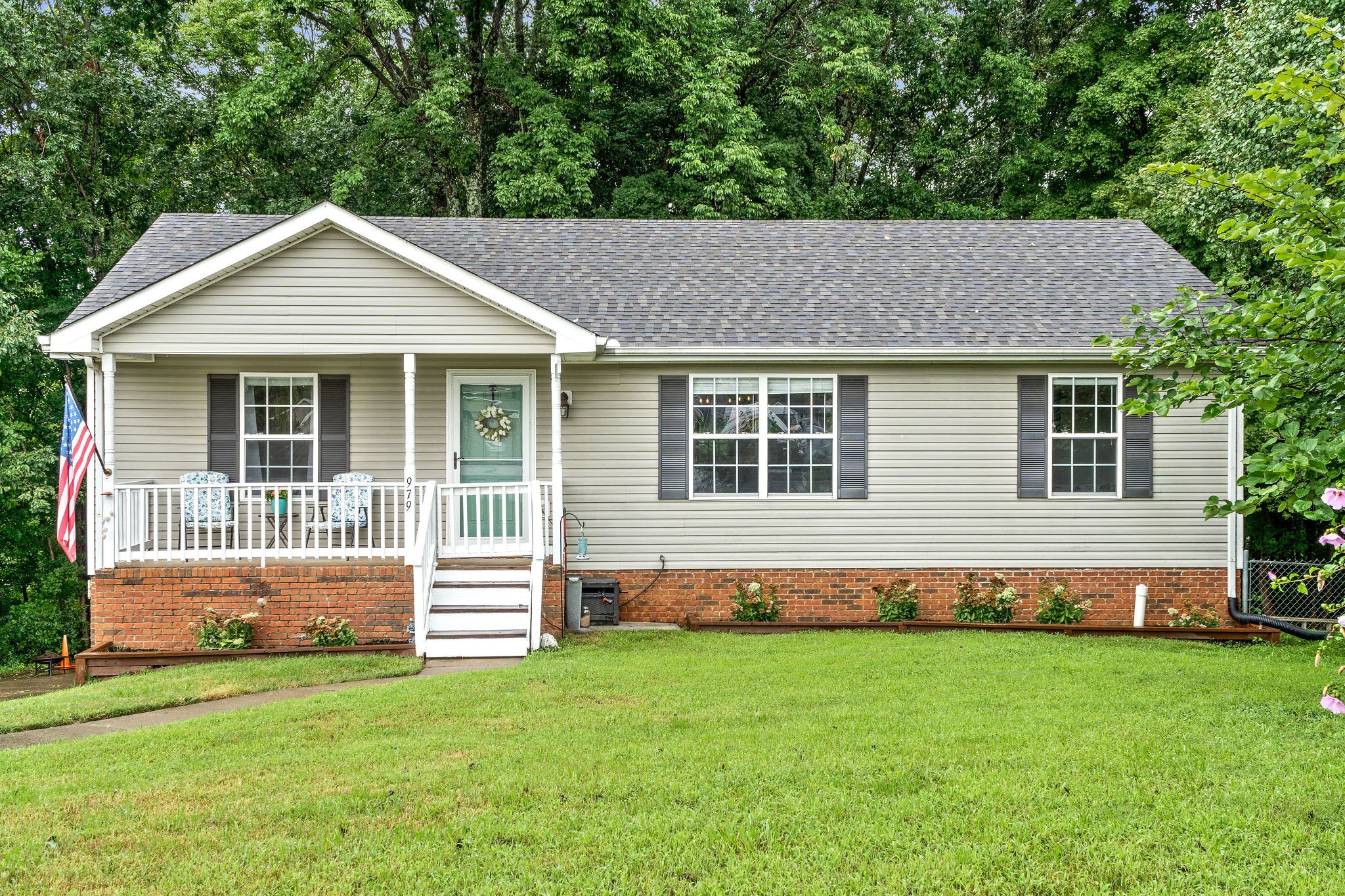 a front view of a house with a yard