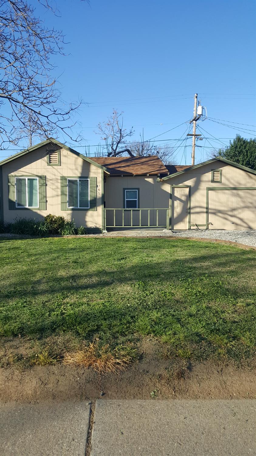 a view of a house with a yard