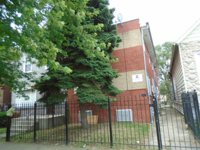 a view of a house with a tree