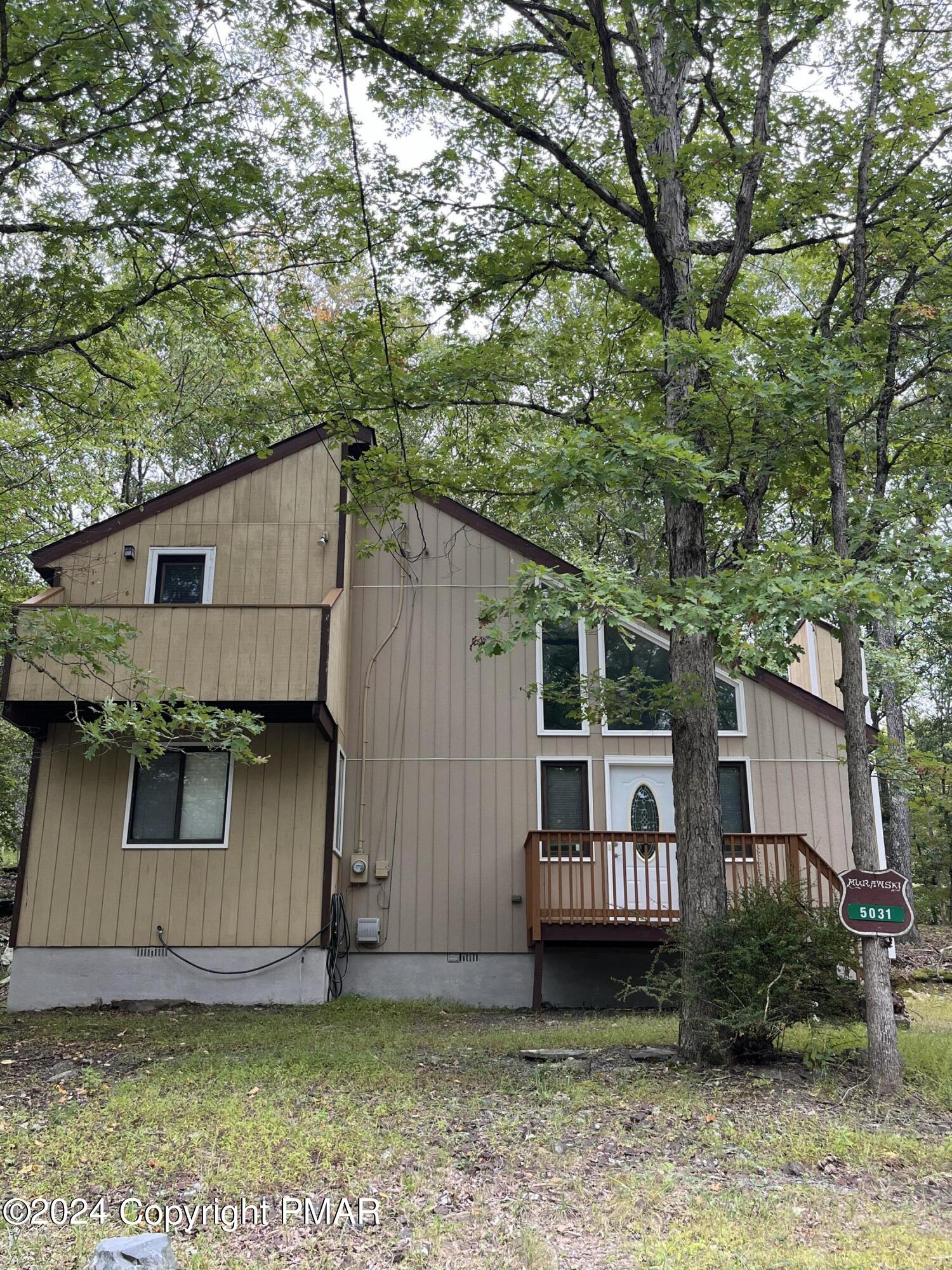 front view of a house with a yard