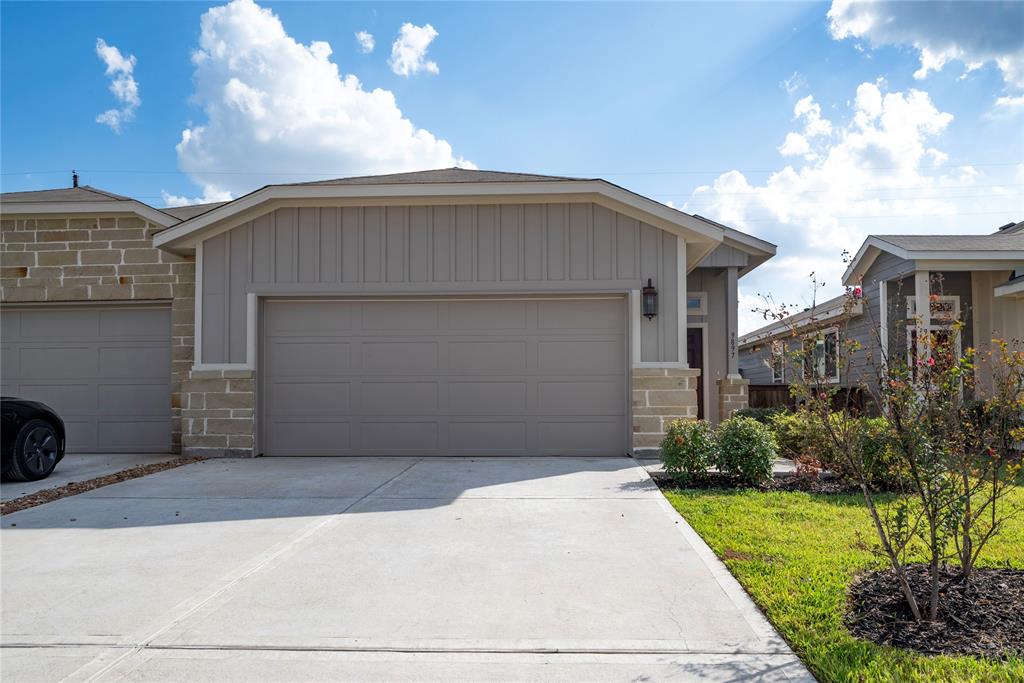 Welcome to this charming residence featuring a spacious double garage and a matching driveway for ample parking.