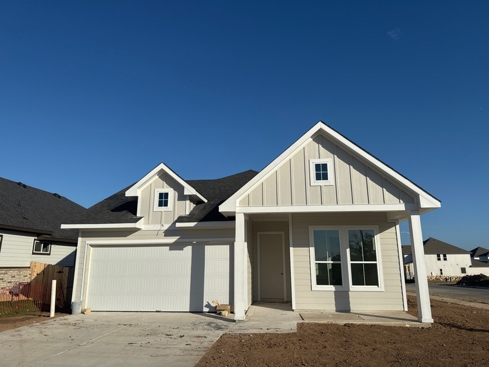 a front view of a house with a garage