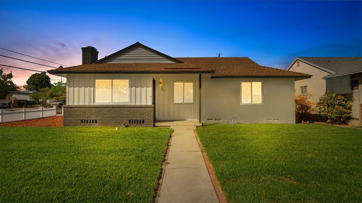 a front view of a house with yard