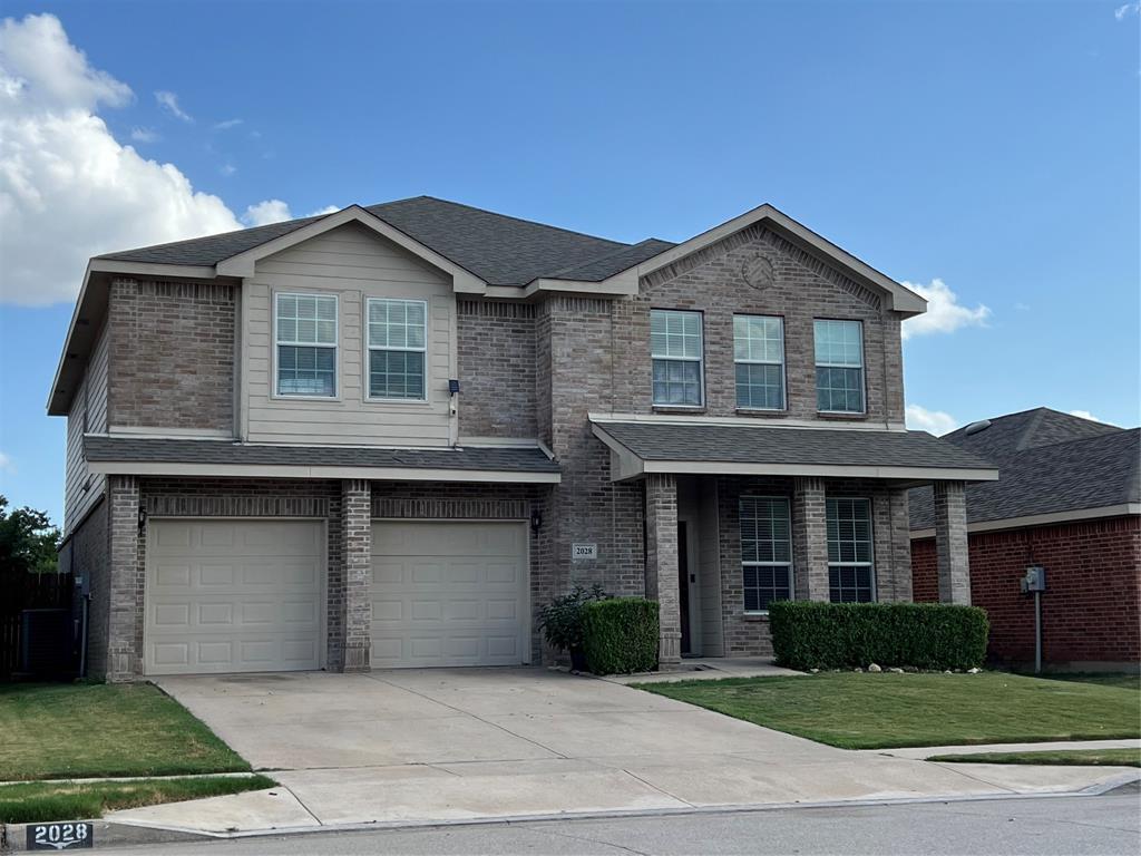 a front view of a house with yard