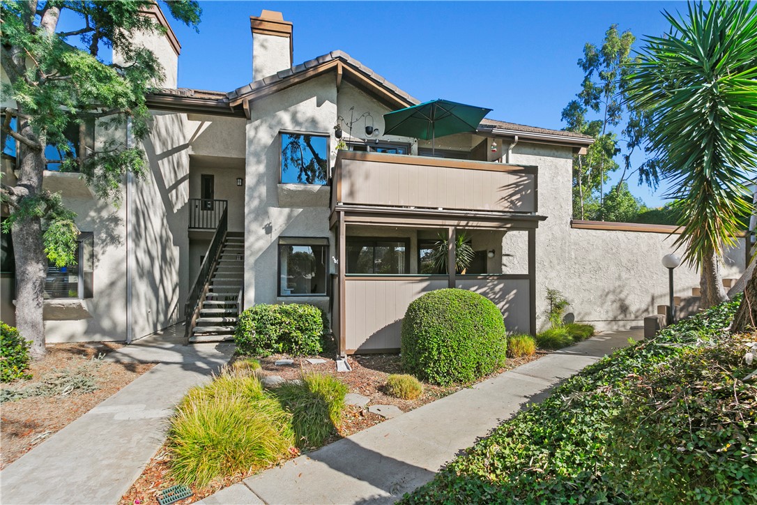 Ground level home with a premium private location in the coveted Brea Canyon Villas