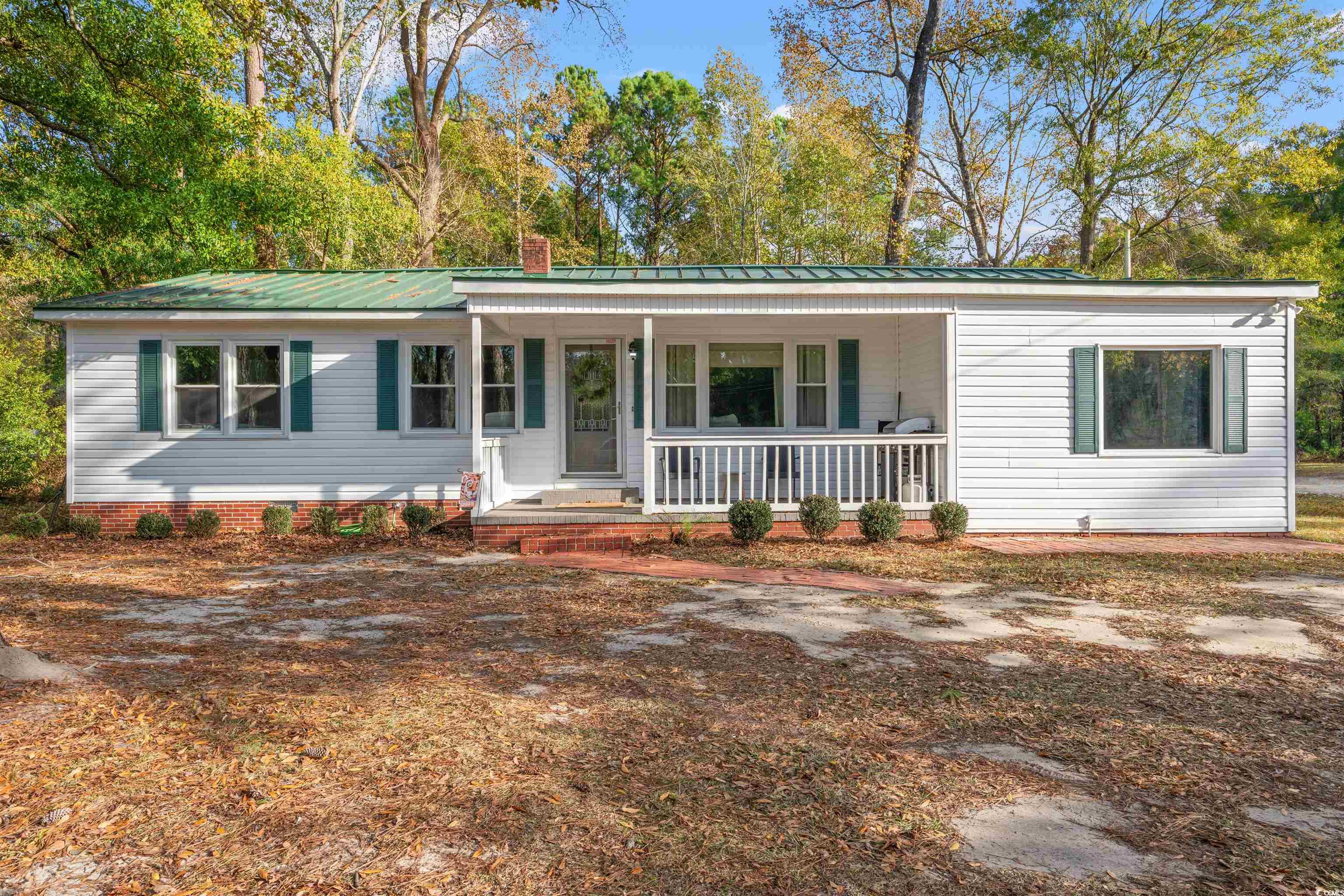 Single story home featuring a porch