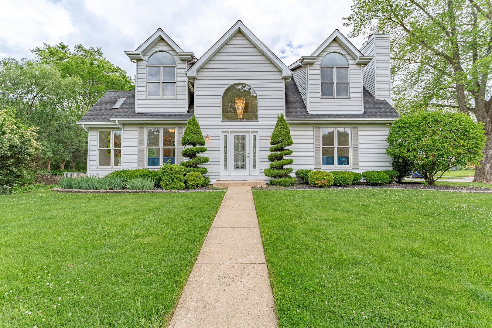 a front view of a house with a yard