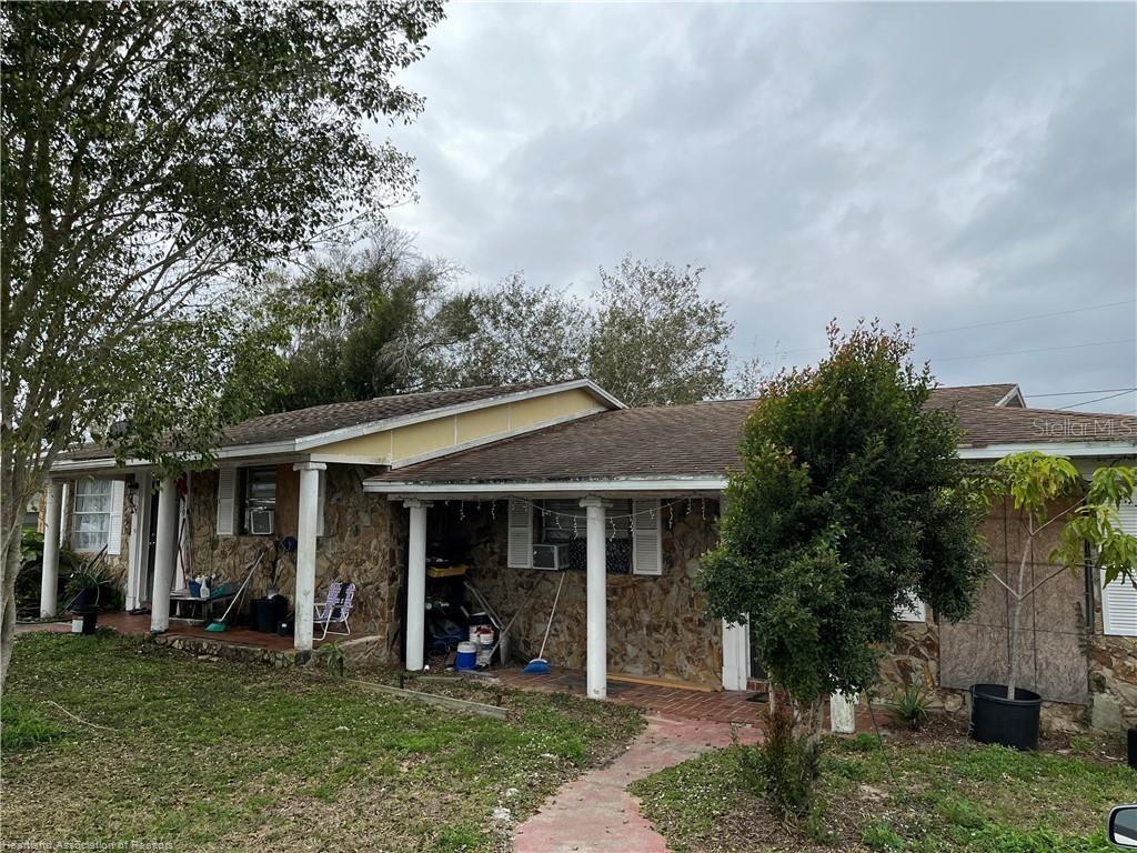 front view of a house with a yard