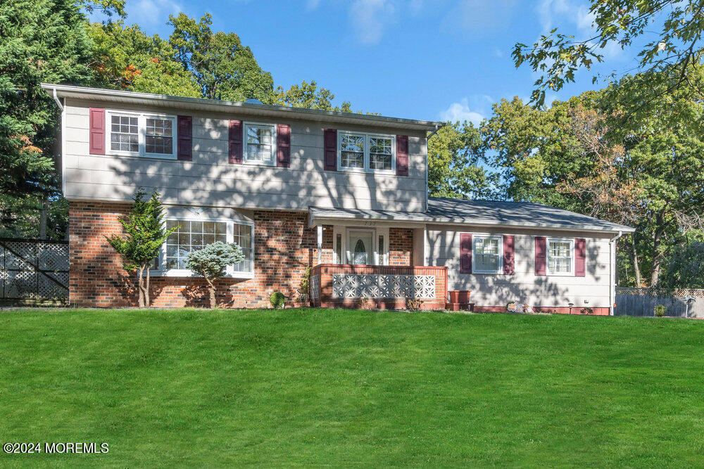 a front view of house with yard and green space