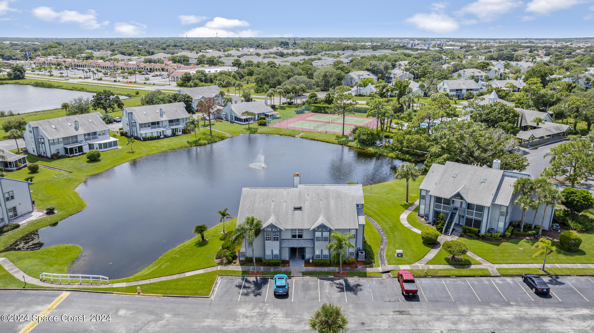 an aerial view of a house with a swimming pool yard and outdoor seating