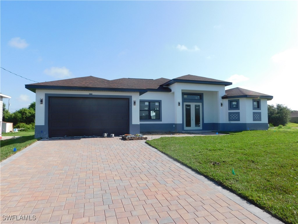 a front view of a house with a yard