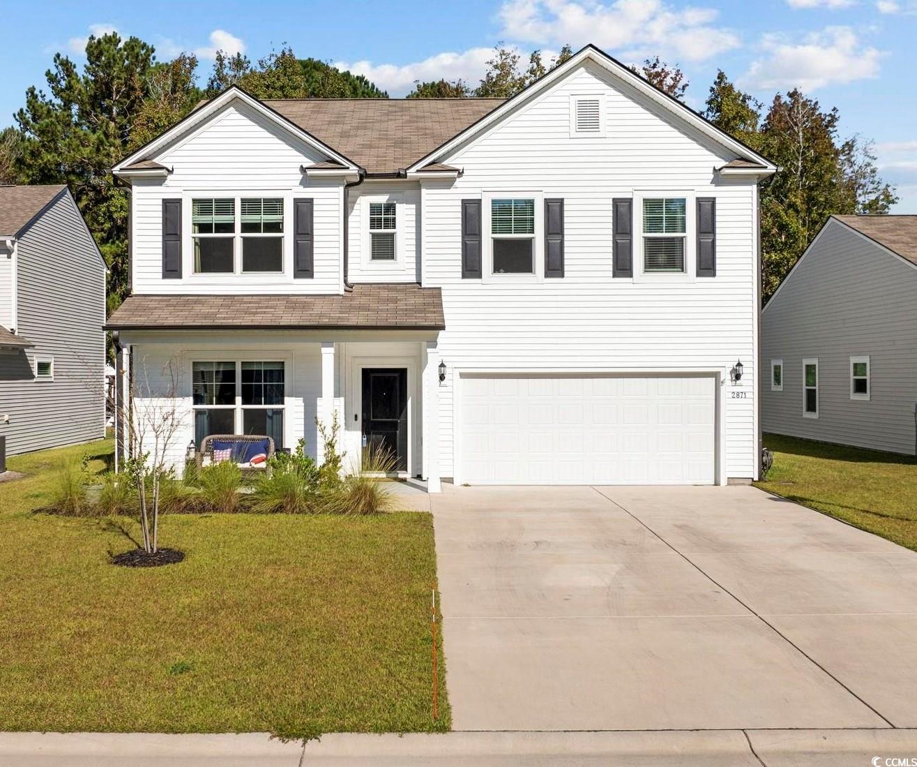 View of front of property with a front lawn, centr