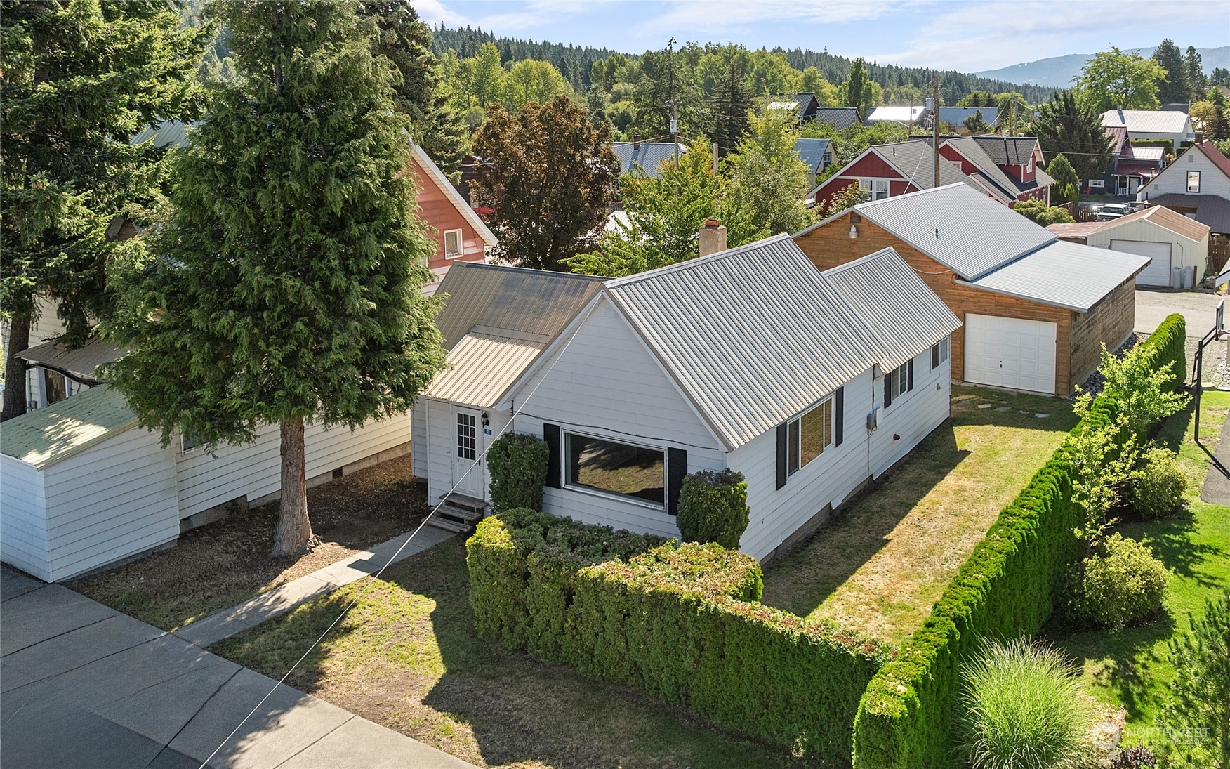 a aerial view of a house with a yard