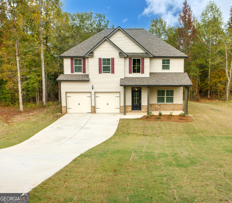 a front view of a house with a yard