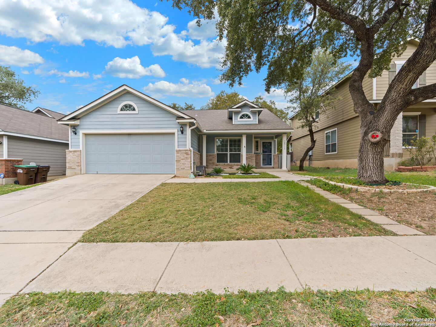 a front view of a house with a yard