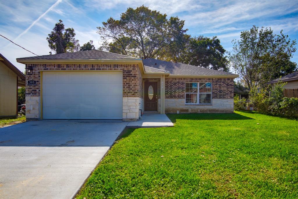 front view of a house with a garden