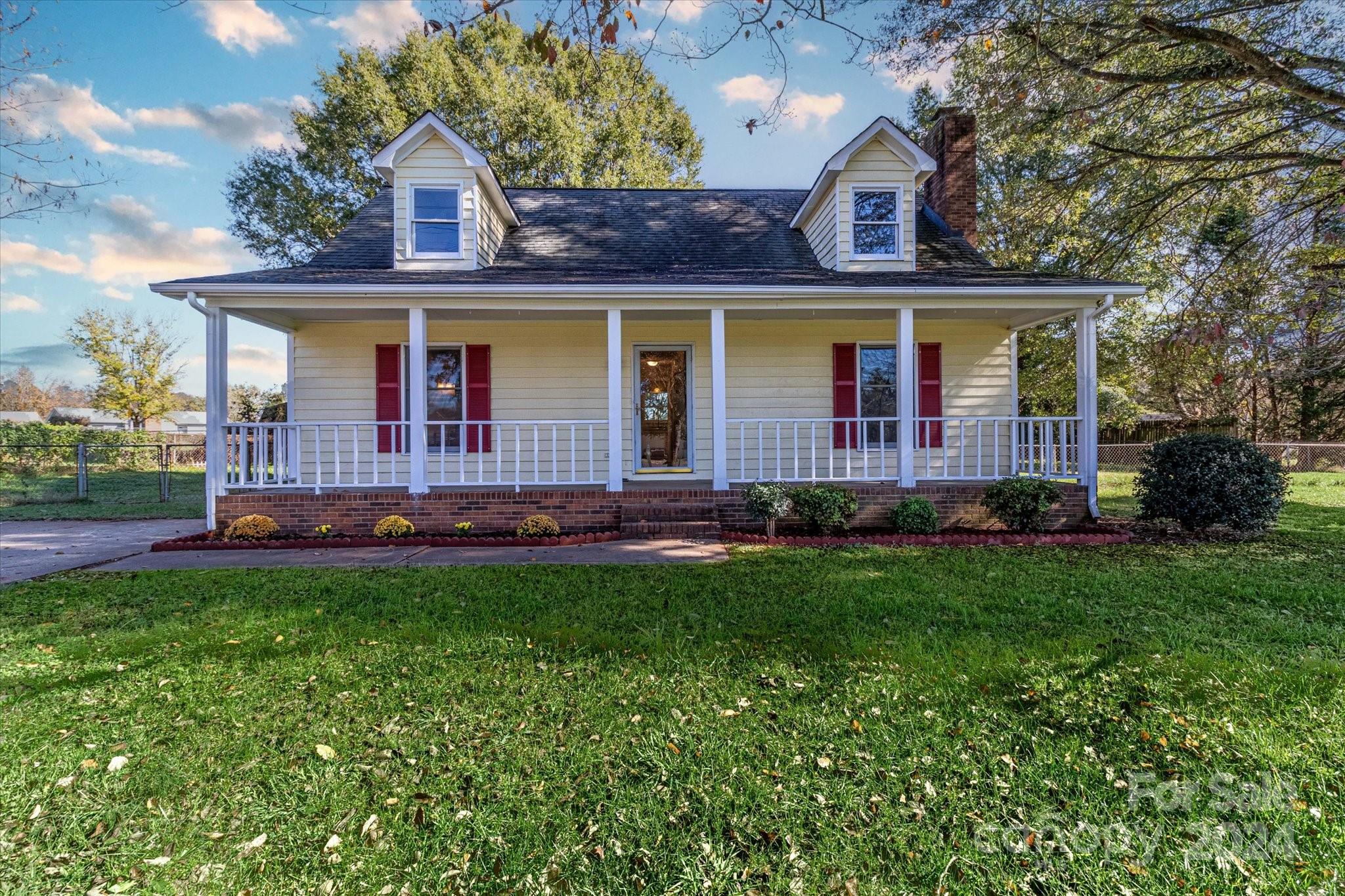 front view of a house with a yard