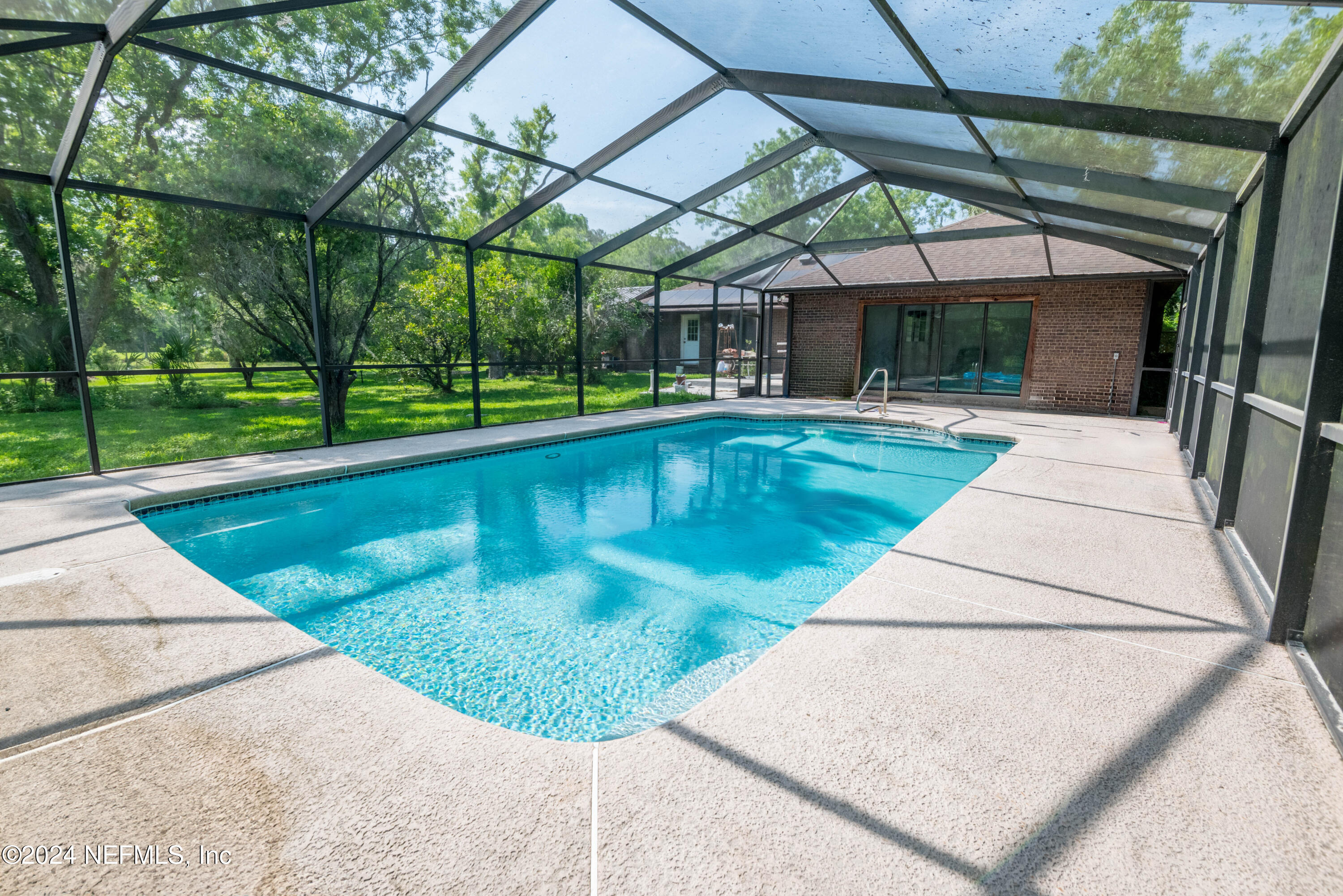 a view of swimming pool with a patio