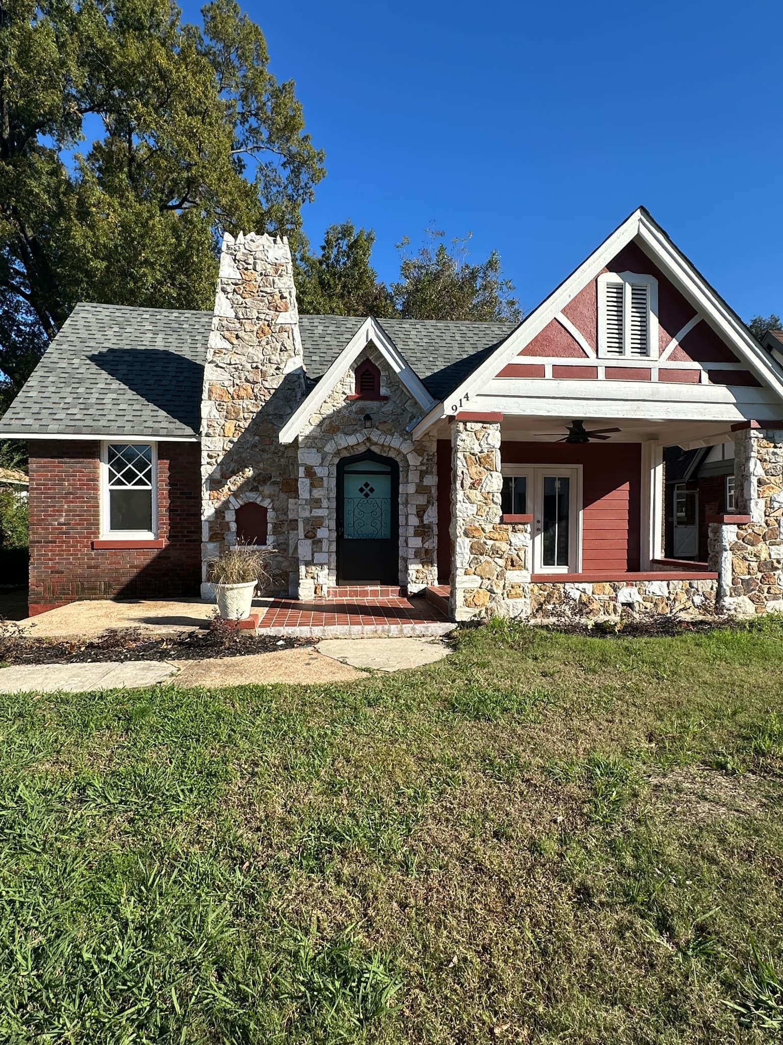 View of front of house with a front lawn and ceiling fan