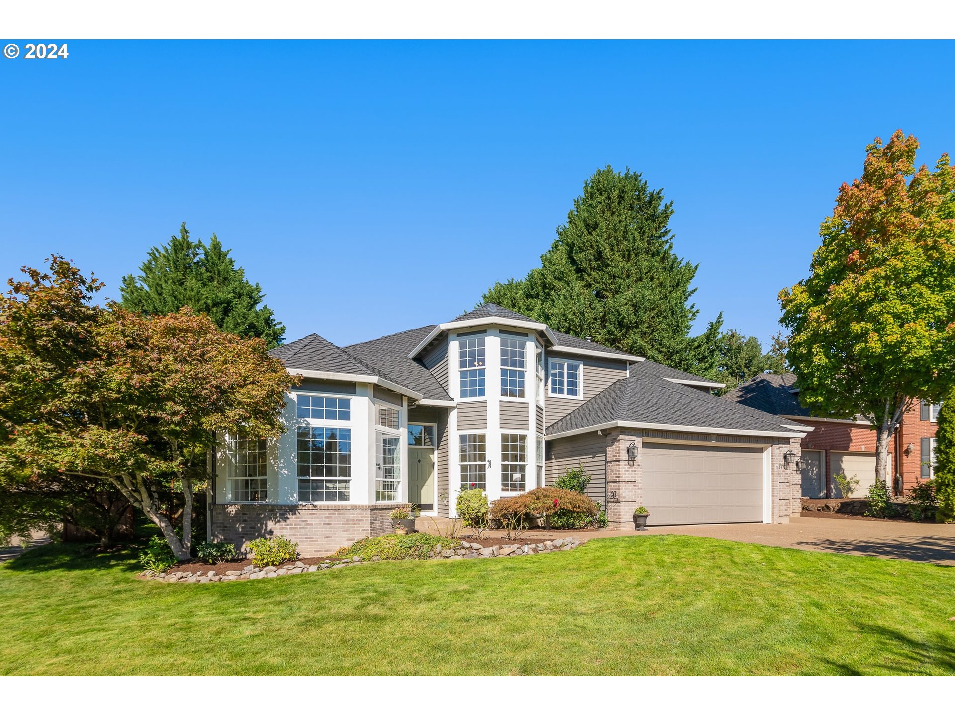 a front view of a house with a yard