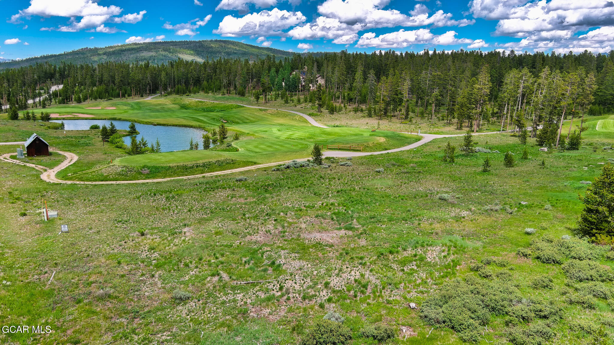 a view of a golf course with a fountain