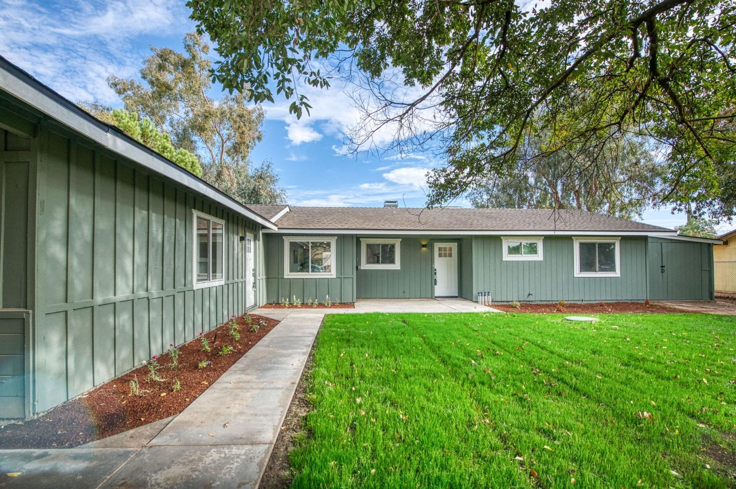 a front view of a house with yard