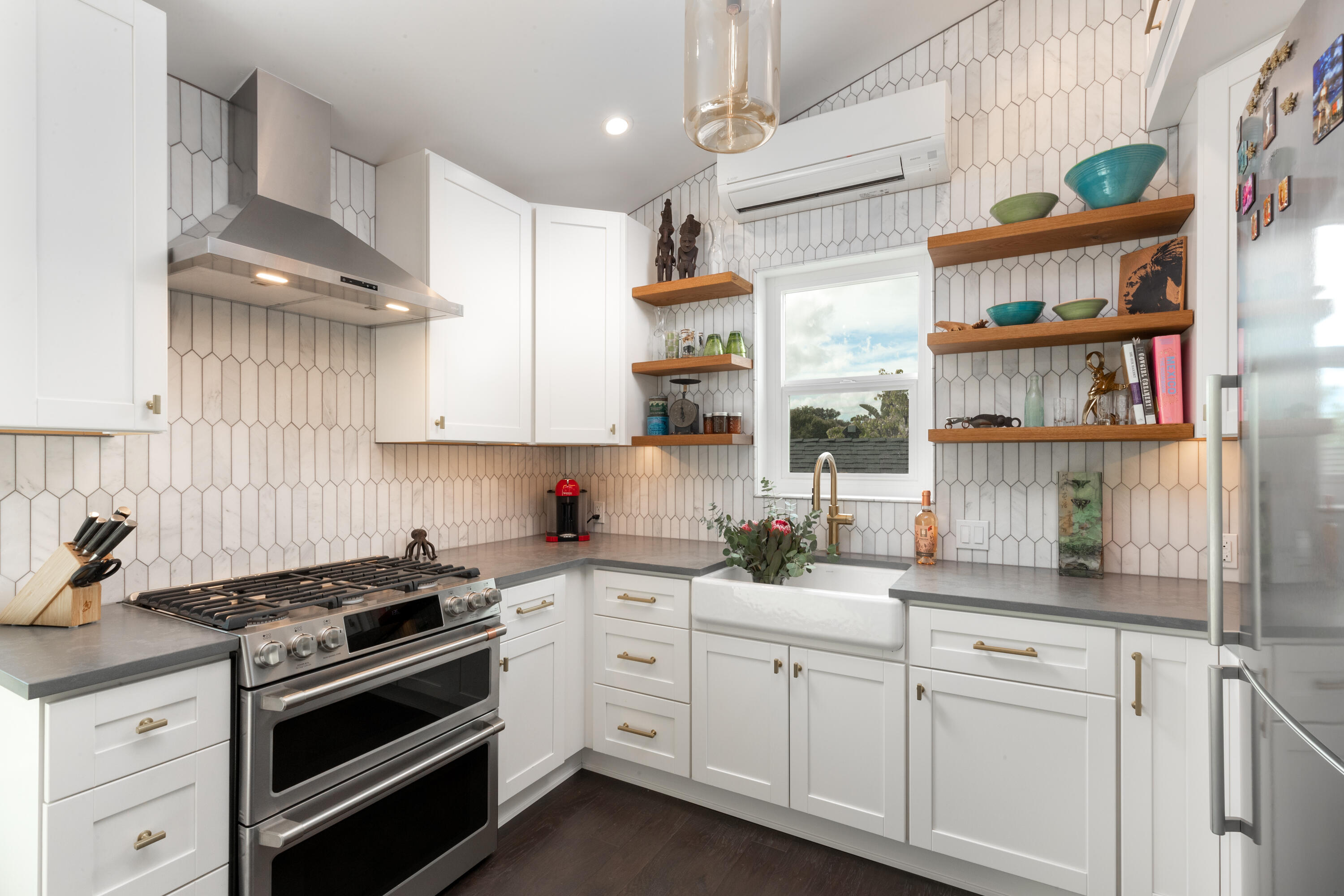 a kitchen with stainless steel appliances granite countertop a stove and cabinets