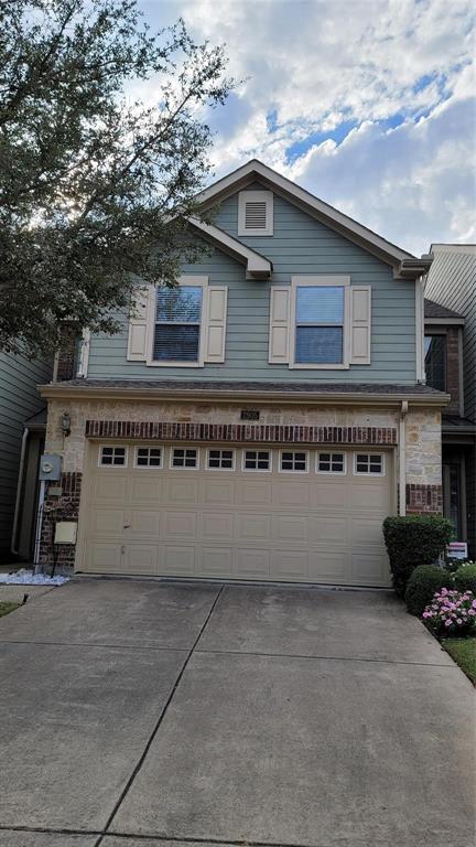 a view of a house with a garage