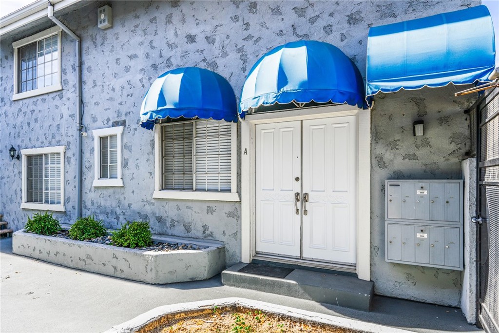 a front view of a house with parking space