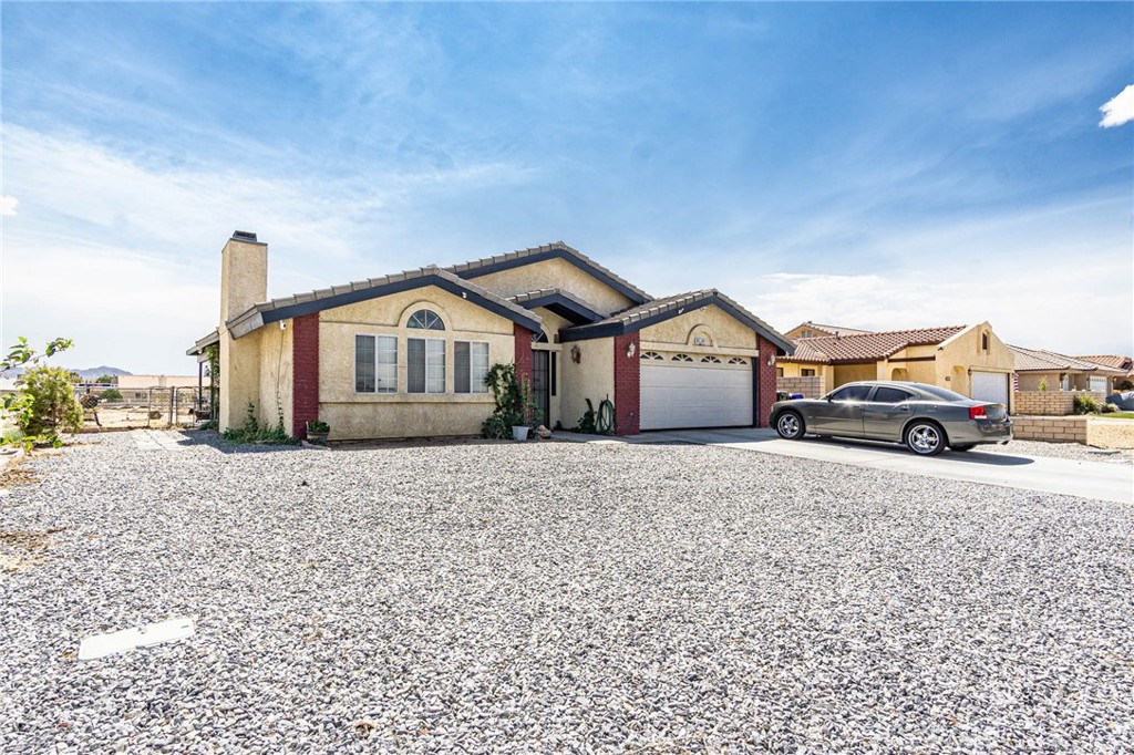 a house view with a car parked in front of it