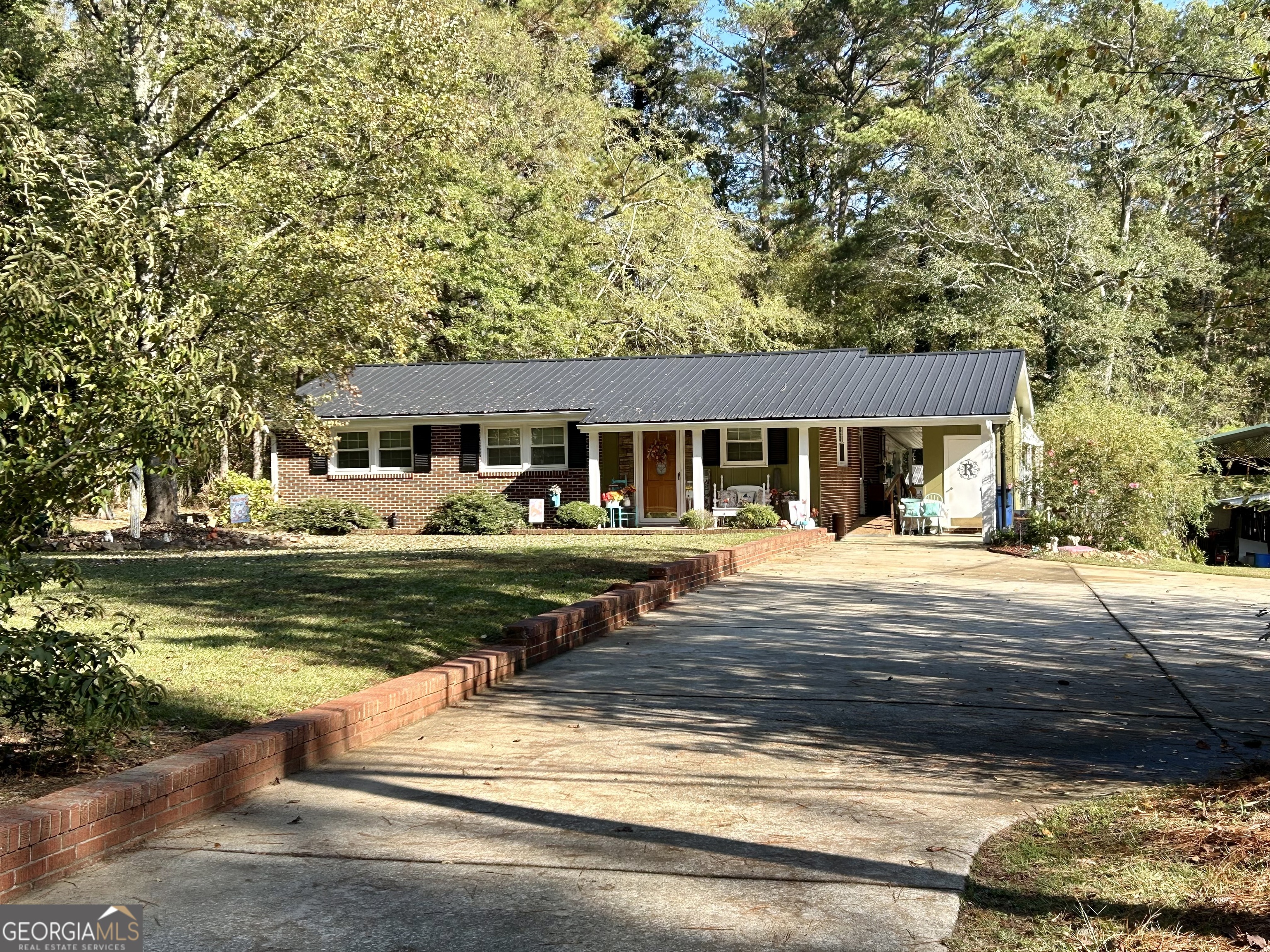 a front view of a house with swimming pool