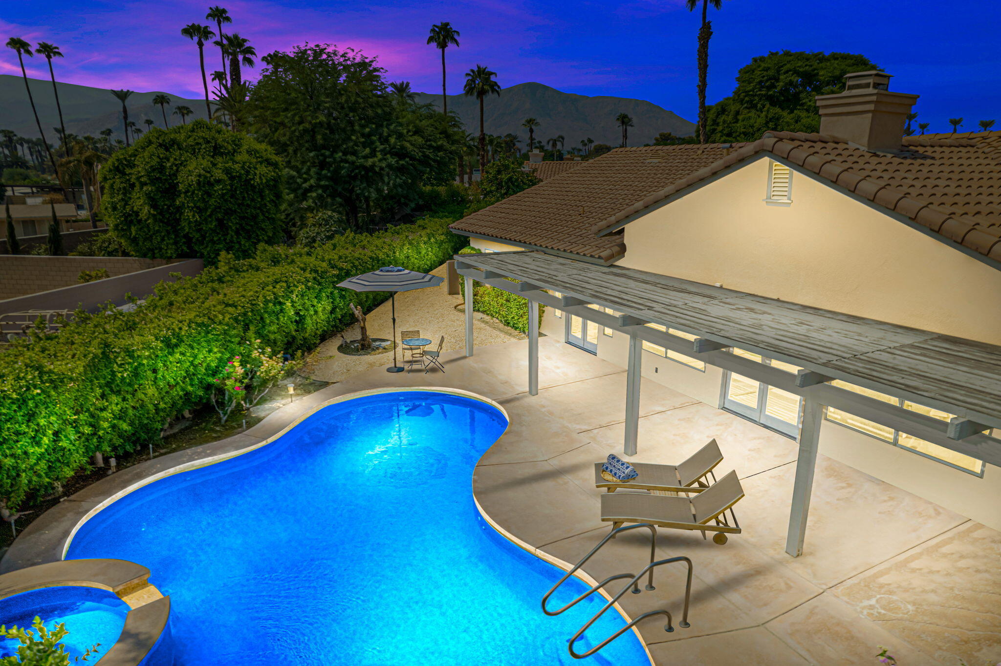 a view of a swimming pool with a lounge chairs