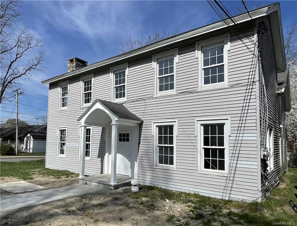 a front view of a house with a porch