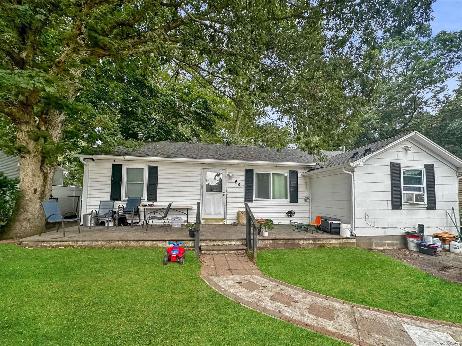 a front view of house with yard and seating area