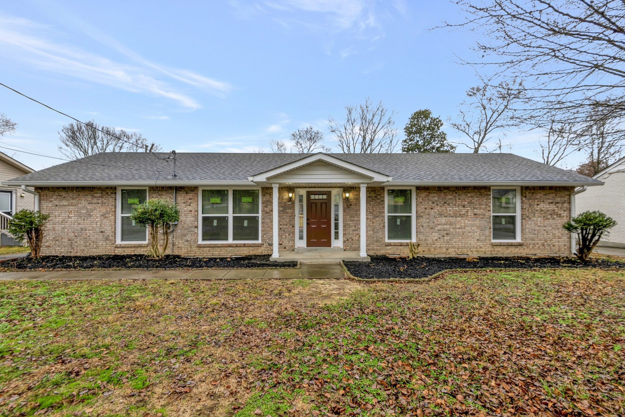 front view of a house with a garden