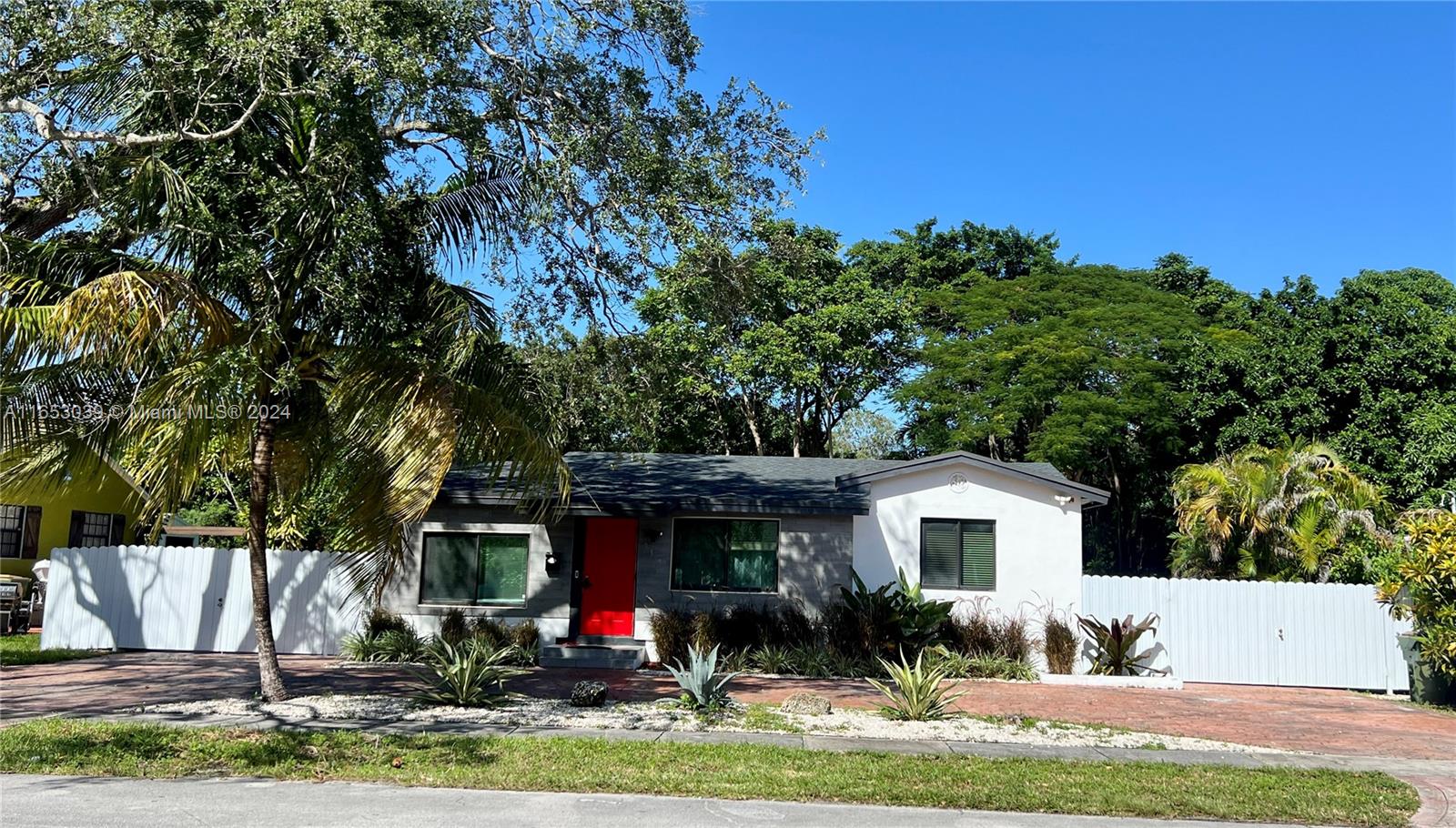 a view of house with yard and entertaining space