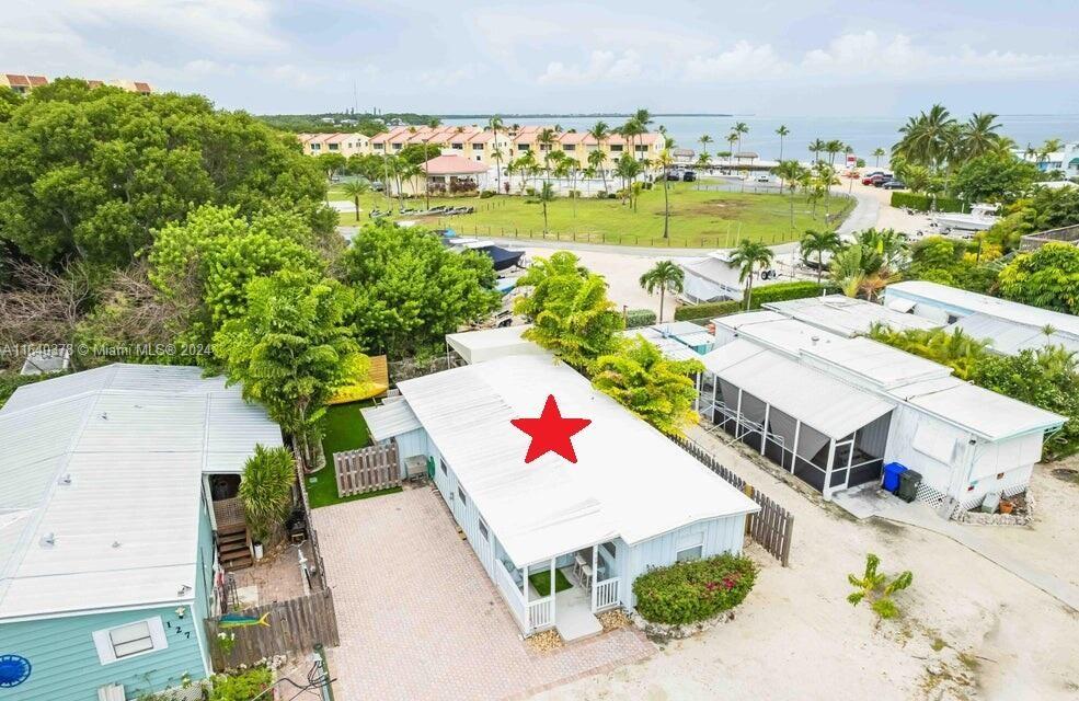 an aerial view of a house with a ocean view