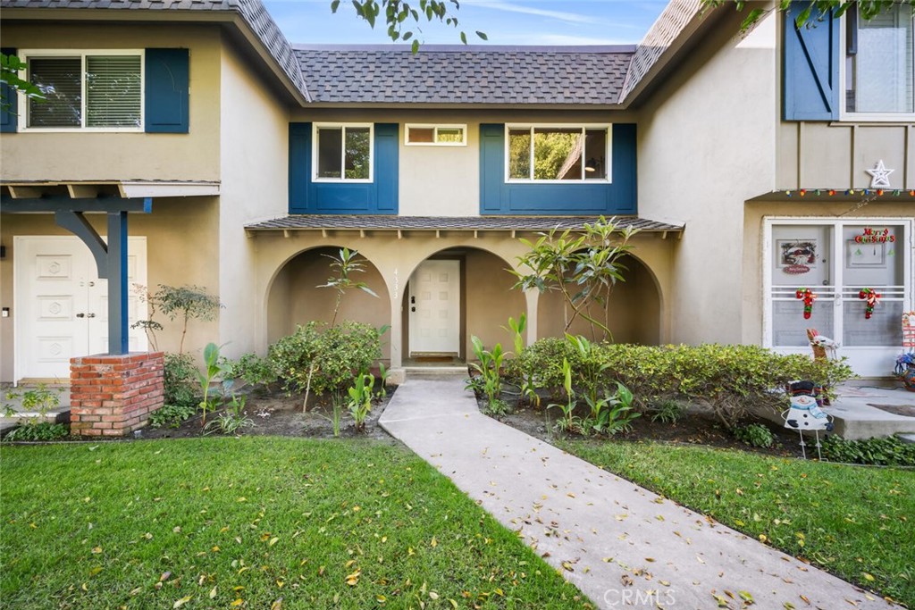 a front view of a house with garden