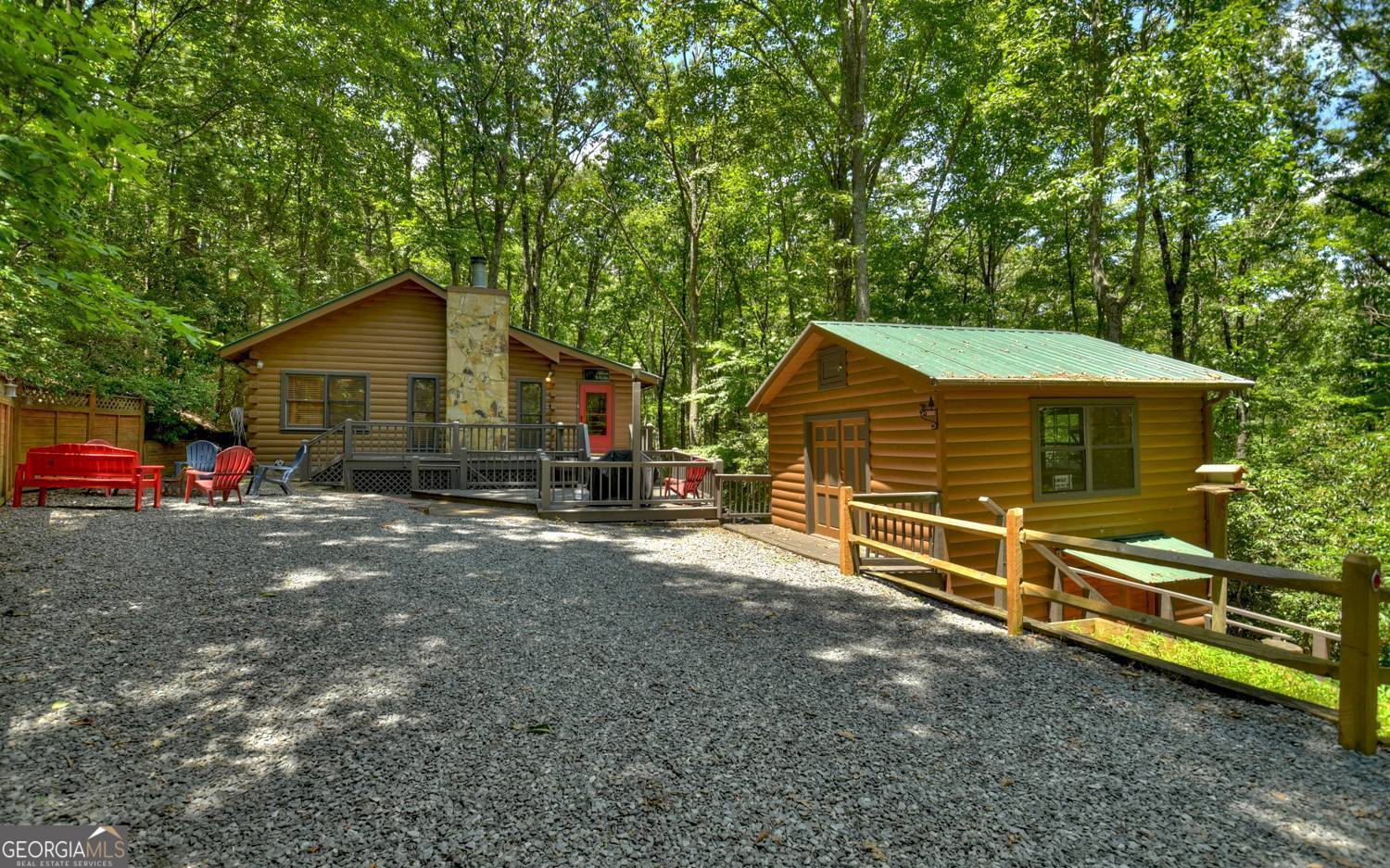 a view of a house with a yard and sitting area