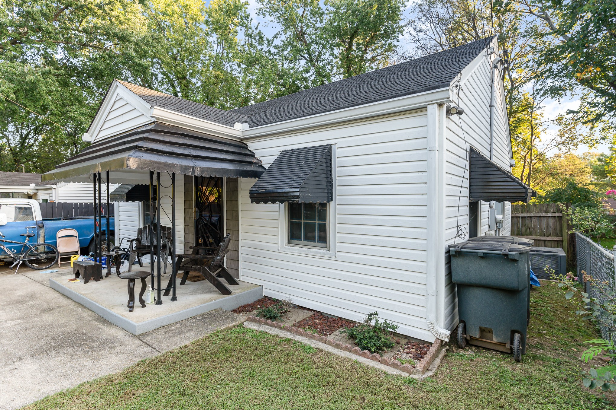 a view of house with patio and outdoor seating