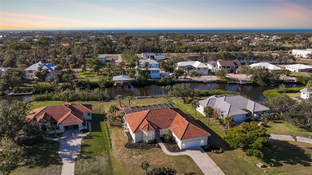 an aerial view of a house with a lake view